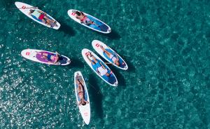 People paddle boarding