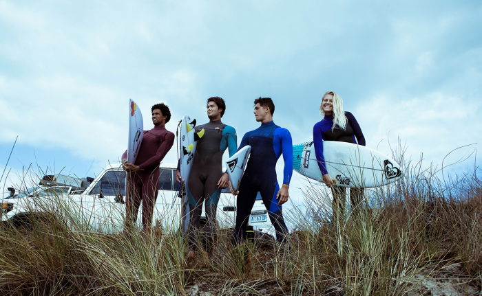 Surfers on beach with boards