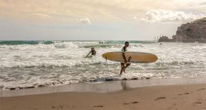 Surfers on the shore