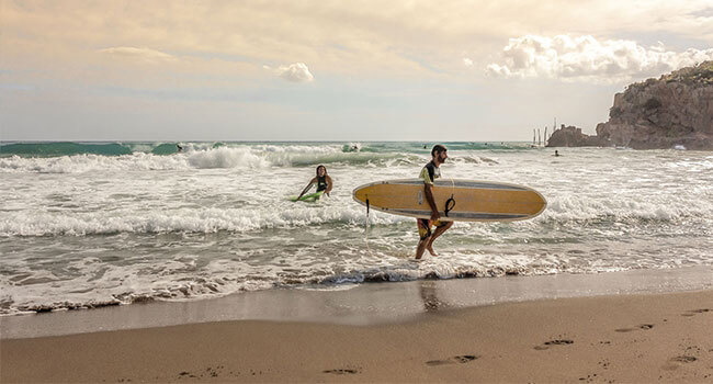 Surfers on the shore